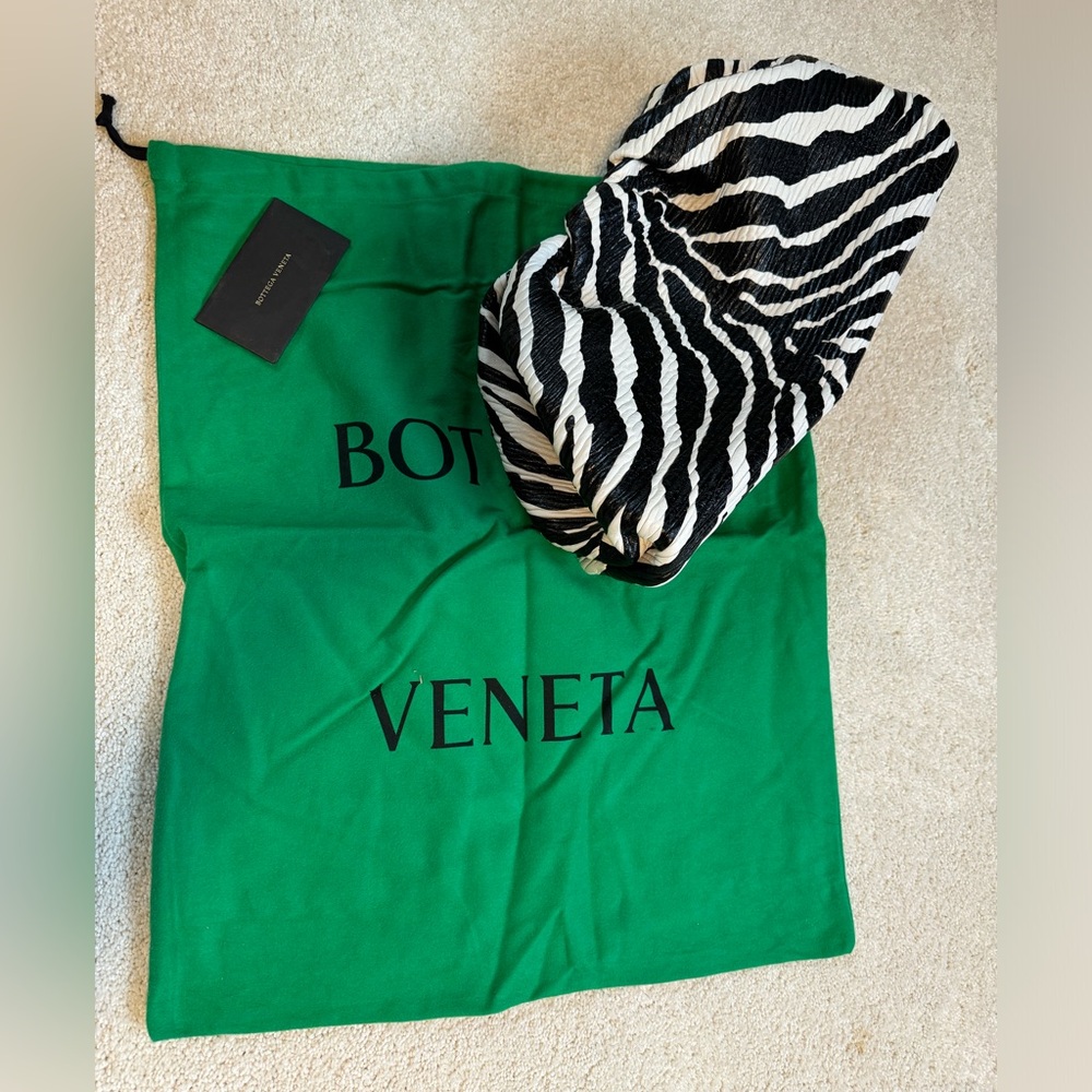 BOTTEGA VENETA
The Pouch medium zebra-printed leather clutch